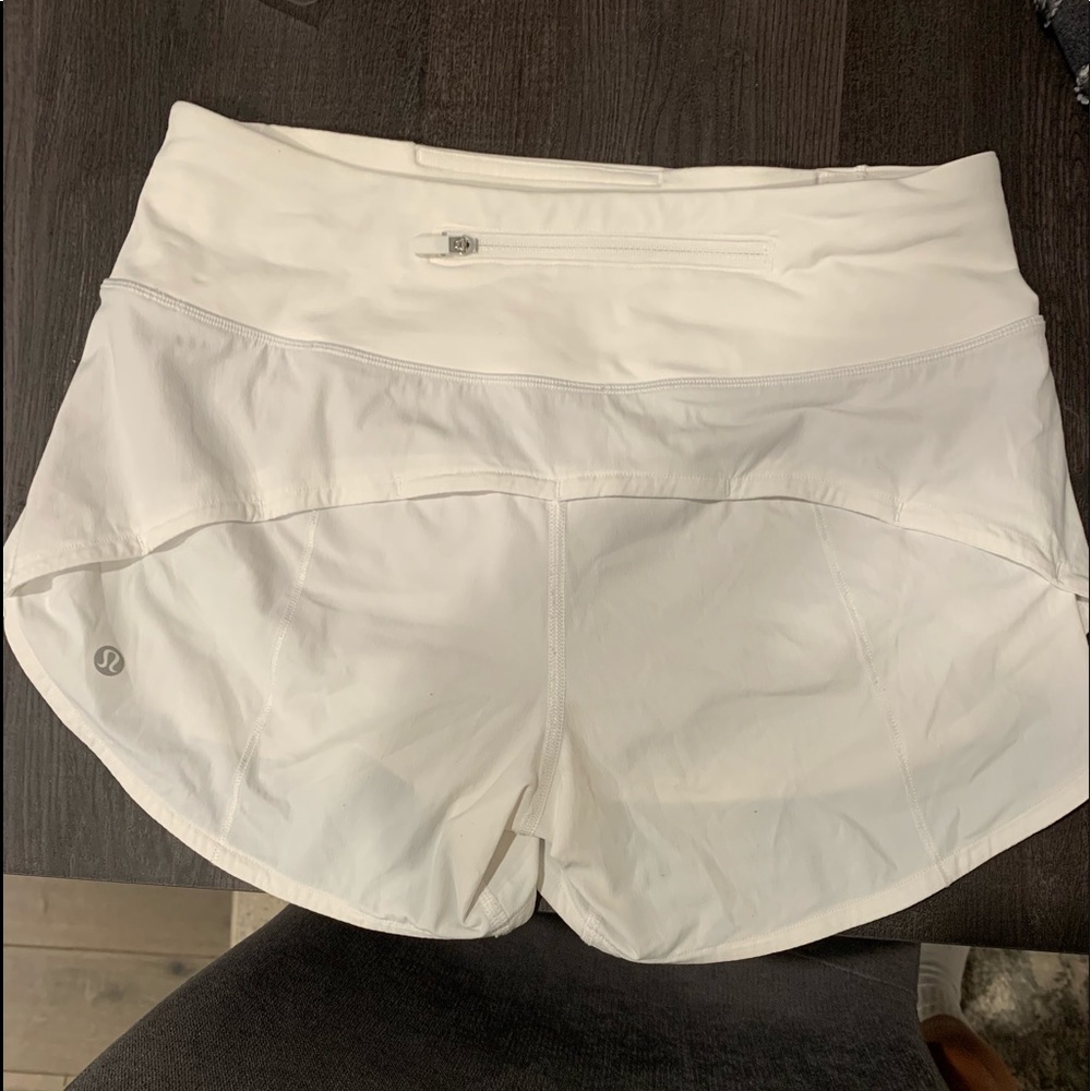 White lululemon speed up shorts. Size 4 and are the longer pair.